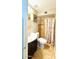 This bathroom is complete with a shower-tub combo and vanity sink at 4810 N 69Th Dr Dr, Phoenix, AZ 85033