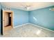 This bedroom features painted walls, tiled floors, and access to another room at 4810 N 69Th Dr Dr, Phoenix, AZ 85033