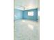 The bright, airy bedroom is brightly painted and features large, sunlit windows at 4810 N 69Th Dr Dr, Phoenix, AZ 85033