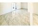 Open-concept living room with sliding glass door access and bright natural light at 4810 N 69Th Dr Dr, Phoenix, AZ 85033