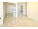 Bright open-concept living room with white walls and sliding glass door access at 4810 N 69Th Dr Dr, Phoenix, AZ 85033