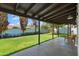 Inviting covered patio overlooking the lush, green backyard with privacy fence at 4837 E Pershing Ave, Scottsdale, AZ 85254
