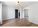 Empty bedroom featuring hardwood floors, sliding closet doors, and modern lighting at 4837 E Pershing Ave, Scottsdale, AZ 85254