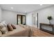 Bedroom with a door to the yard, neutral walls, and wood floors at 4837 E Pershing Ave, Scottsdale, AZ 85254