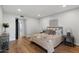 Cozy bedroom featuring neutral decor, hardwood flooring, and ample natural light at 4837 E Pershing Ave, Scottsdale, AZ 85254