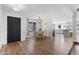 Bright dining area with modern lighting, wood floors, and access to kitchen at 4837 E Pershing Ave, Scottsdale, AZ 85254