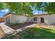 Charming single-story home with manicured lawn, desert landscaping, and inviting arched entryway at 4837 E Pershing Ave, Scottsdale, AZ 85254