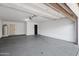 Spacious two car garage featuring sealed concrete floors and a water heater at 4837 E Pershing Ave, Scottsdale, AZ 85254