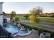 Scenic aerial view of the pool, hot tub, putting green, golf course, and surrounding landscape at 5610 E Sanna St, Paradise Valley, AZ 85253