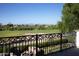 Scenic view of the golf course from a balcony with decorative iron railing and outdoor seating area at 5610 E Sanna St, Paradise Valley, AZ 85253