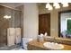 Bathroom featuring a tiled shower, toilet, a vanity with a sink, and a large mirror at 5610 E Sanna St, Paradise Valley, AZ 85253