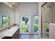 Bathroom showcasing a vanity, tiled shower, toilet, and a window providing natural light at 5610 E Sanna St, Paradise Valley, AZ 85253