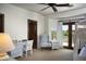 Bright bedroom featuring a desk, a chair, a bunk bed, and balcony access with stunning golf course views at 5610 E Sanna St, Paradise Valley, AZ 85253