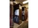 Well-organized walk-in closet featuring ample storage, custom shelving, and a full-length mirror at 5610 E Sanna St, Paradise Valley, AZ 85253