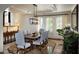 Elegant dining room with tray ceiling, modern chandelier, and neutral paint at 5610 E Sanna St, Paradise Valley, AZ 85253