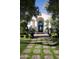 Beautifully landscaped front entrance with a tiled walkway leading to the home's elegant arched entryway at 5610 E Sanna St, Paradise Valley, AZ 85253