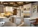 Spacious kitchen with island seating, custom cabinetry, and stainless steel refrigerator at 5610 E Sanna St, Paradise Valley, AZ 85253