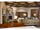Cozy living room boasts a stone fireplace, wooden accents, and a comfortable seating area at 5610 E Sanna St, Paradise Valley, AZ 85253