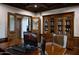 Well-appointed home office featuring custom wood finishes, built-in shelving, and ample workspace at 5610 E Sanna St, Paradise Valley, AZ 85253