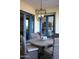 Inviting patio with a round table and blue French doors leading to the inside at 5610 E Sanna St, Paradise Valley, AZ 85253