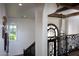 Elegant staircase with wrought iron details and stylish lighting fixtures at 5610 E Sanna St, Paradise Valley, AZ 85253