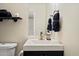 Contemporary bathroom with a sleek vanity, modern fixtures, and convenient toilet at 6005 N Granite Reef Rd, Scottsdale, AZ 85250