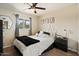 Comfortable bedroom with neutral tones, a ceiling fan, and carpet flooring at 6005 N Granite Reef Rd, Scottsdale, AZ 85250