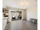 Open dining area with sliding glass doors to outdoor patio, neutral tones, and modern light fixture at 6005 N Granite Reef Rd, Scottsdale, AZ 85250