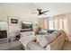 Bright living room featuring a comfortable sectional sofa, stylish decor, and ample natural light at 6005 N Granite Reef Rd, Scottsdale, AZ 85250