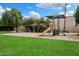 Neighborhood playground with swings, slide, and a shady play area at 6005 N Granite Reef Rd, Scottsdale, AZ 85250