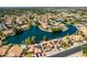 Beautiful aerial view of lakeside homes with solar panels, pools, and mature trees in a suburban neighborhood at 608 E Stonebridge Dr, Gilbert, AZ 85234