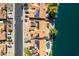 Aerial shot showing homes with solar panels and swimming pools located on a tranquil waterfront at 608 E Stonebridge Dr, Gilbert, AZ 85234