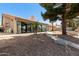 Spacious backyard showcasing large windows and meticulously maintained landscaping at 608 E Stonebridge Dr, Gilbert, AZ 85234