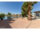 Picturesque waterfront backyard with lush landscaping and a tranquil ambiance at 608 E Stonebridge Dr, Gilbert, AZ 85234