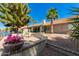 Beautiful backyard patio with lush landscaping and serene waterfront views at 608 E Stonebridge Dr, Gilbert, AZ 85234