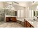 Luxurious primary bathroom featuring double sinks, soaking tub, and walk-in shower at 608 E Stonebridge Dr, Gilbert, AZ 85234