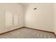 Cozy bedroom showcasing neutral carpet, single window, and plenty of space for furniture at 608 E Stonebridge Dr, Gilbert, AZ 85234
