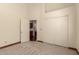 Neutral bedroom showcasing closet, open bathroom, and modern gray carpet throughout the room at 608 E Stonebridge Dr, Gilbert, AZ 85234