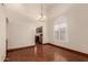 Dining room with a chandelier fixture and an arched window, opening to the kitchen at 608 E Stonebridge Dr, Gilbert, AZ 85234
