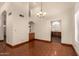 Dining room with chandelier, and kitchen access featuring built in cabinets at 608 E Stonebridge Dr, Gilbert, AZ 85234
