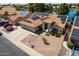 This single Gathering home has solar panels, a two car garage and desert landscaping at 608 E Stonebridge Dr, Gilbert, AZ 85234