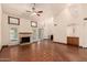 Open-concept living room featuring a fireplace and views of the kitchen at 608 E Stonebridge Dr, Gilbert, AZ 85234
