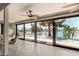 Sun room featuring a waterfront view, ceiling fan, tile flooring and lots of natural light at 608 E Stonebridge Dr, Gilbert, AZ 85234