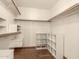 Walk-in closet with built-in shelving and ample storage space at 608 E Stonebridge Dr, Gilbert, AZ 85234