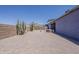 Landscaped backyard with desert plants, a hot tub, and a covered patio, perfect for outdoor enjoyment at 6154 S Borego Rd, Gold Canyon, AZ 85118