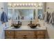 Bathroom featuring double vanity with unique bowl sinks and updated fixtures at 6154 S Borego Rd, Gold Canyon, AZ 85118