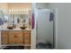 Bright bathroom featuring a double vanity with bowl sinks and a glass-enclosed shower at 6154 S Borego Rd, Gold Canyon, AZ 85118