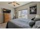Bedroom featuring a ceiling fan, natural lighting, and modern decor at 6154 S Borego Rd, Gold Canyon, AZ 85118