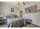 Bedroom featuring a ceiling fan, natural lighting, and modern decor at 6154 S Borego Rd, Gold Canyon, AZ 85118