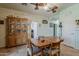 Dining area featuring wood-look flooring, a china cabinet, and a dining table set at 6154 S Borego Rd, Gold Canyon, AZ 85118